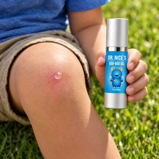 One pearl-sized dot of Boo-Boo Gel on a child's knee, bottle in hand